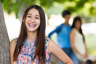 Teen with braces smiling